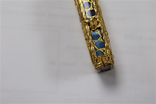 An early 20th century continental gold overlaid enamelled glass scent bottle, 75mm.